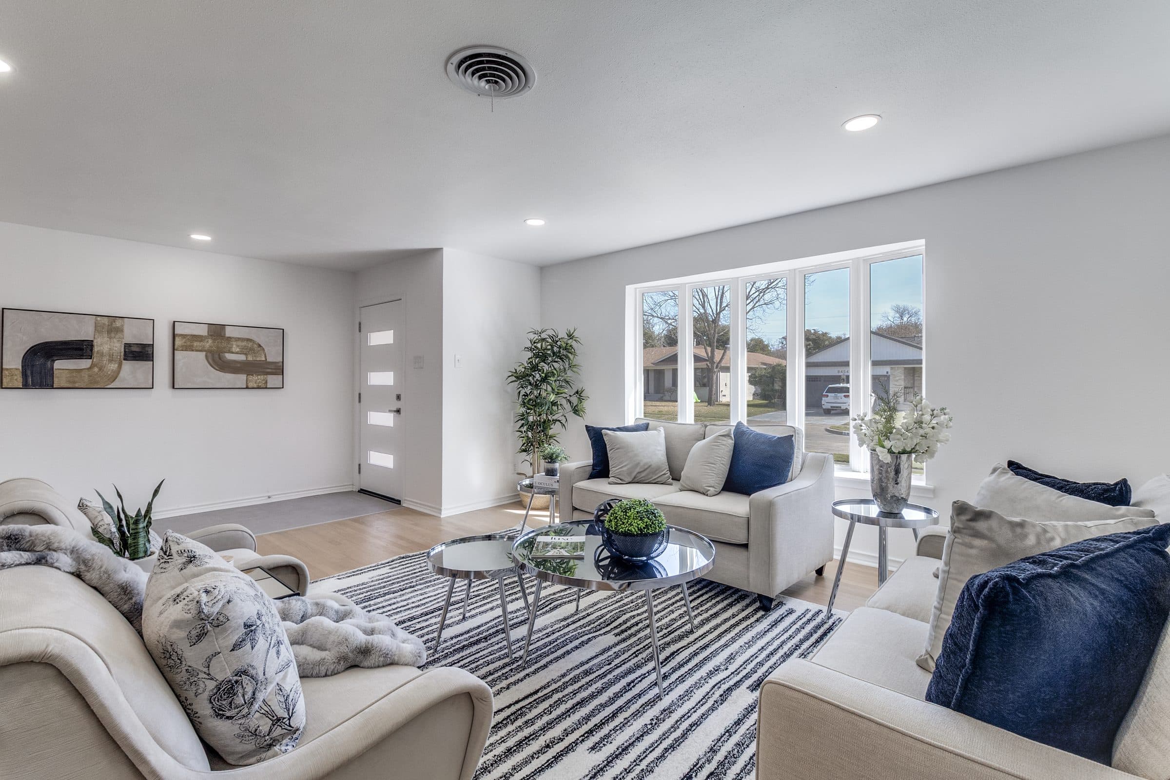 Neutral-toned staged living room with layered textiles